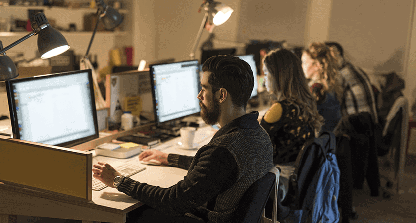 Team members enjoying their newly optimized workstations