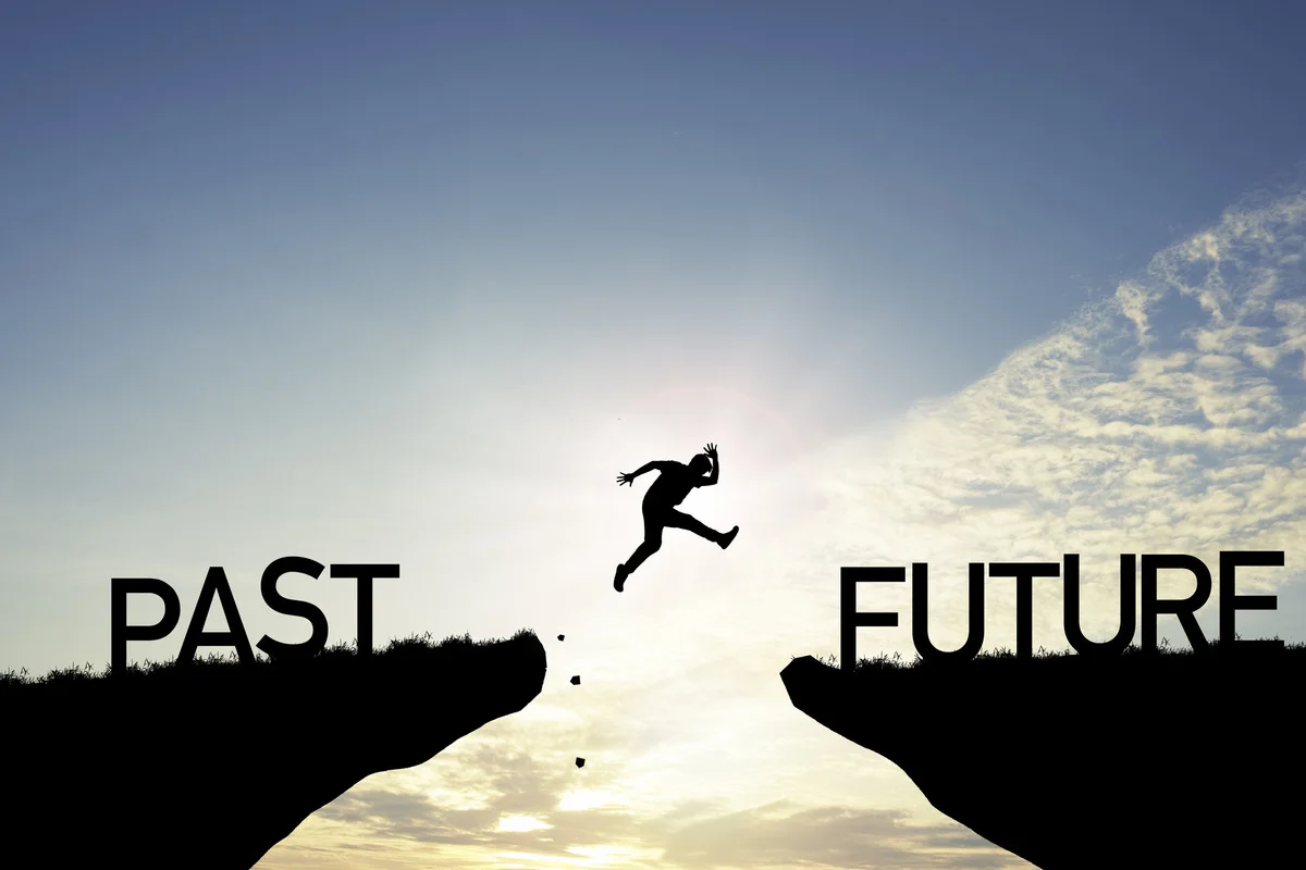 person jumping from past to future
